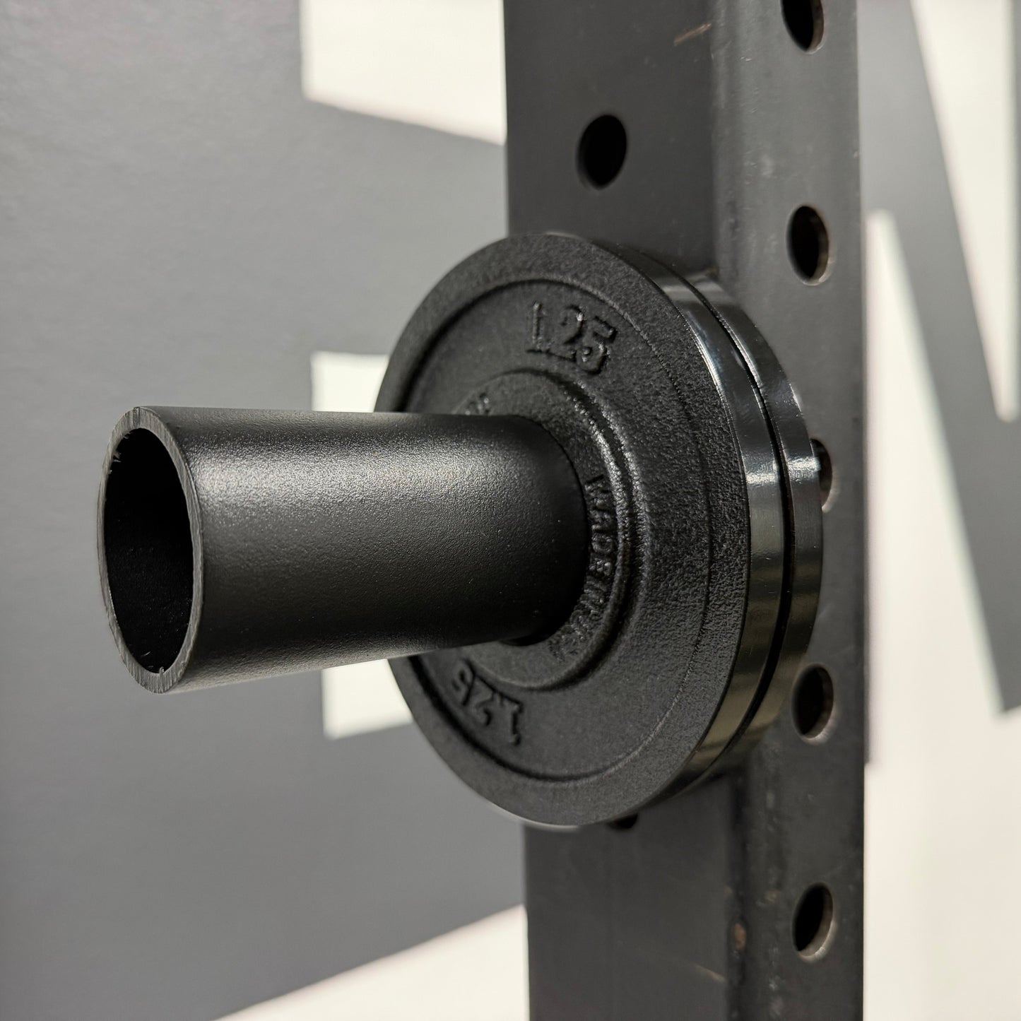 Magnetic Olympic Barbell Change and Micro Plate Storage Peg