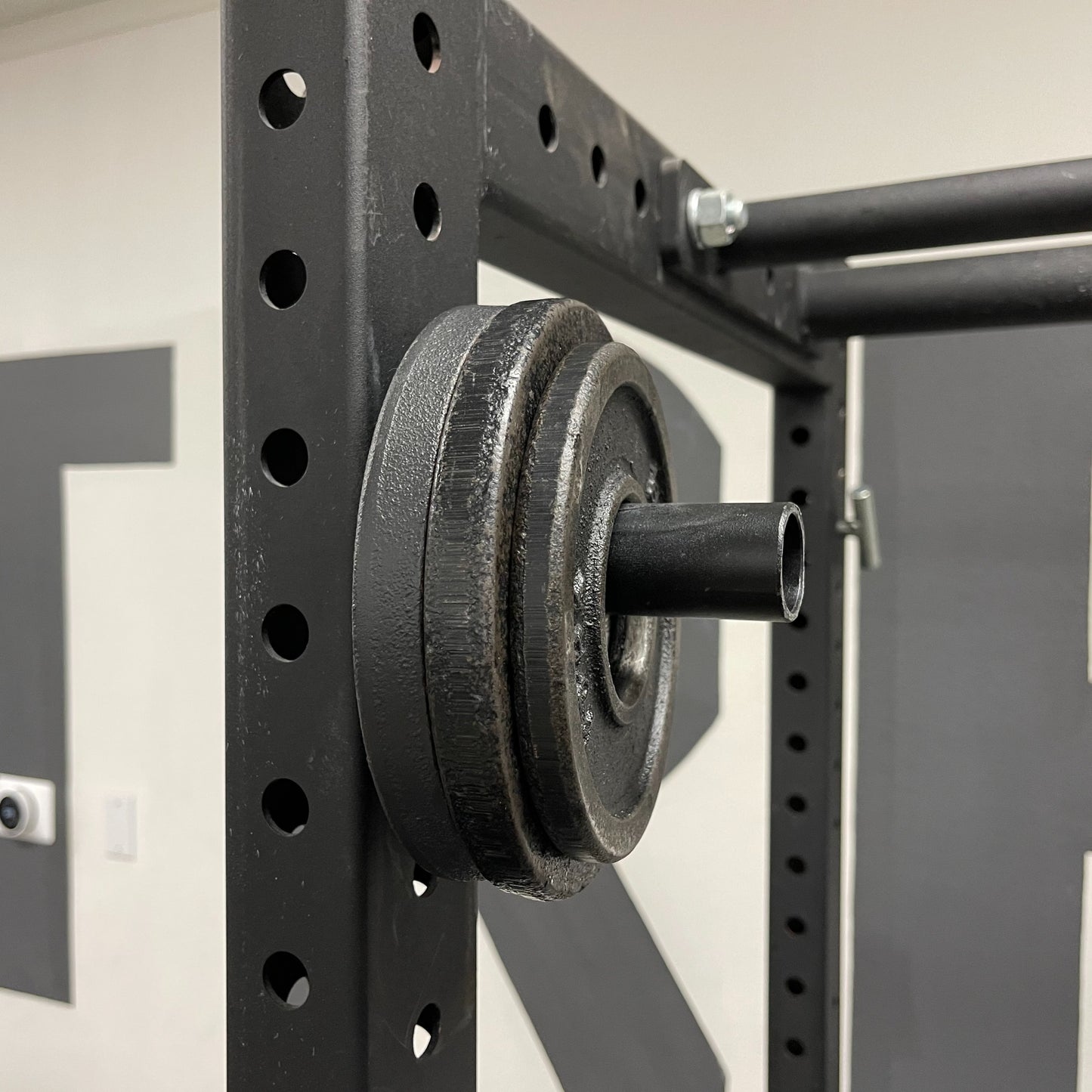 Magnetic Olympic Barbell Change and Micro Plate Storage Peg